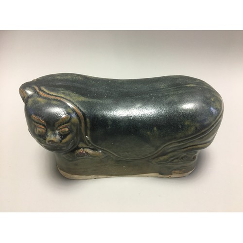 100 - Chinese - AN EARLY CHINESE BLACK GLAZED POTTERY PILLOW possibly Tang Dynasty, formed as a recumbent ... 