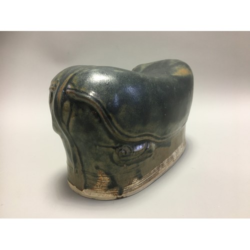 100 - Chinese - AN EARLY CHINESE BLACK GLAZED POTTERY PILLOW possibly Tang Dynasty, formed as a recumbent ... 