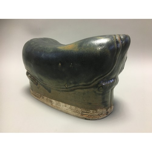 100 - Chinese - AN EARLY CHINESE BLACK GLAZED POTTERY PILLOW possibly Tang Dynasty, formed as a recumbent ... 
