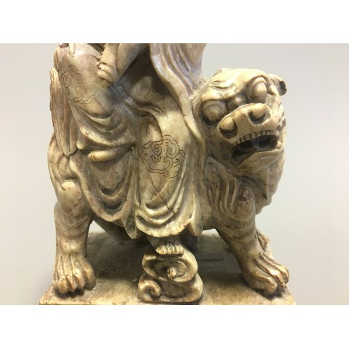 112 - Chinese well carved Soapstone Shi Hou Guanyin, Guanyin atop a Lion.H 18cm