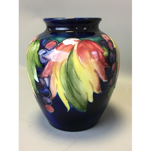 73 - Period Moorcroft Good Sized Leaf and Berry Vase on Deep Blue Ground. Fully Signed to the base Potter... 