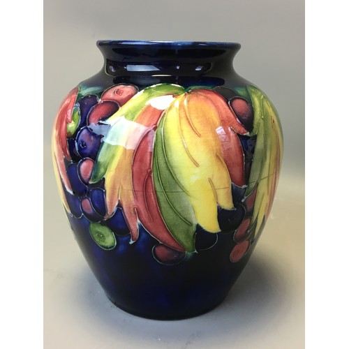 73 - Period Moorcroft Good Sized Leaf and Berry Vase on Deep Blue Ground. Fully Signed to the base Potter... 