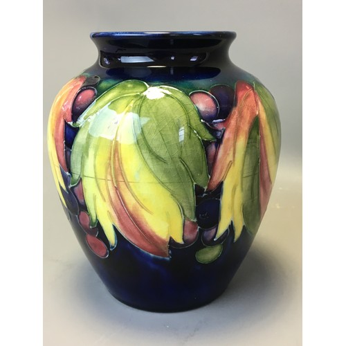 73 - Period Moorcroft Good Sized Leaf and Berry Vase on Deep Blue Ground. Fully Signed to the base Potter... 