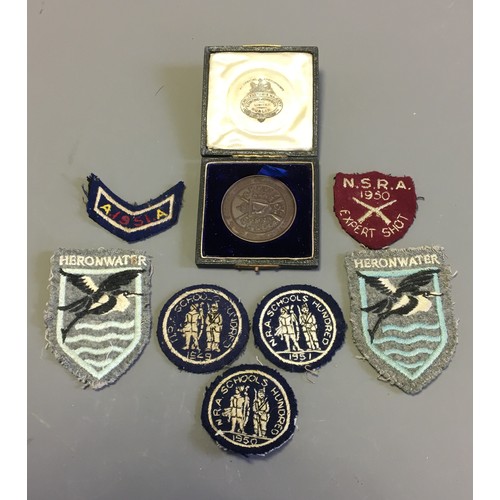 42 - A 1908 Dublin Civil Service Rifle Club Bronze Medallion and a collection of Vintage Cloth Shooting B... 