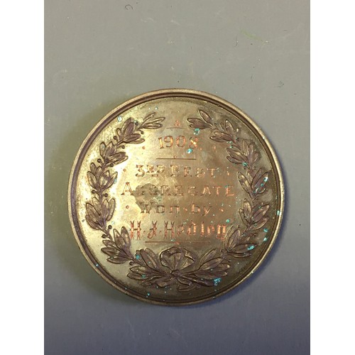 42 - A 1908 Dublin Civil Service Rifle Club Bronze Medallion and a collection of Vintage Cloth Shooting B... 