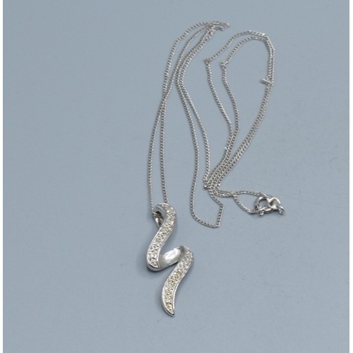 2512 - 9ct white gold Diamond scroll pendant necklace hallmarked as Diamond on a 9ct white gold neck chain ... 