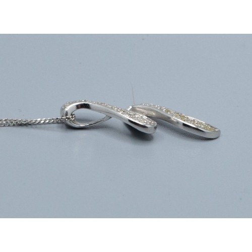 2512 - 9ct white gold Diamond scroll pendant necklace hallmarked as Diamond on a 9ct white gold neck chain ... 
