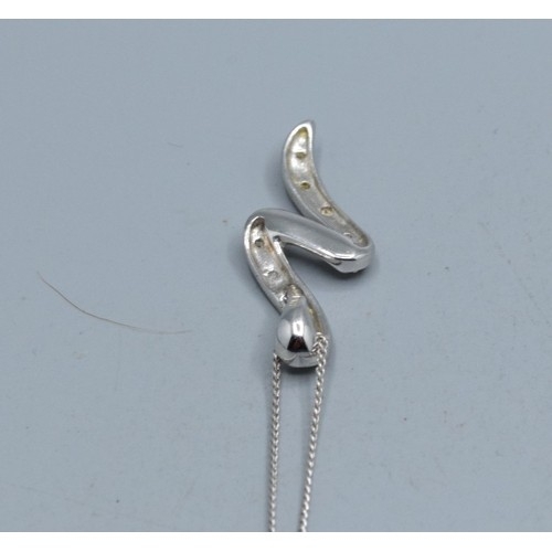 2512 - 9ct white gold Diamond scroll pendant necklace hallmarked as Diamond on a 9ct white gold neck chain ... 