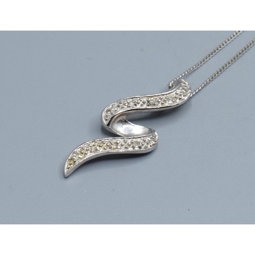 2512 - 9ct white gold Diamond scroll pendant necklace hallmarked as Diamond on a 9ct white gold neck chain ... 