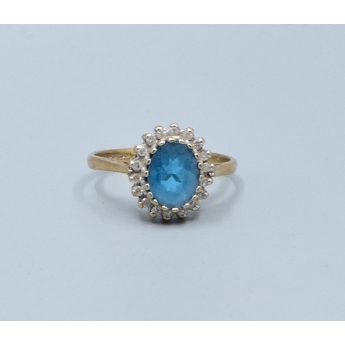 2515 - Vintage 9ct gold ladies Aquamarine and oval halo cluster ring held in a claw setting with the head b... 