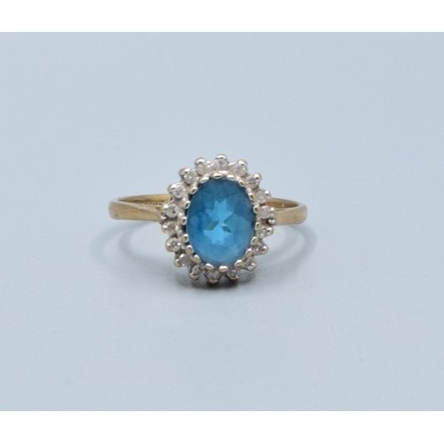 2515 - Vintage 9ct gold ladies Aquamarine and oval halo cluster ring held in a claw setting with the head b... 