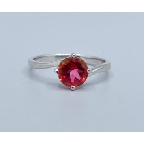 2526 - 925 silver enhanced Ruby solitaire dress ring in a twist design size T