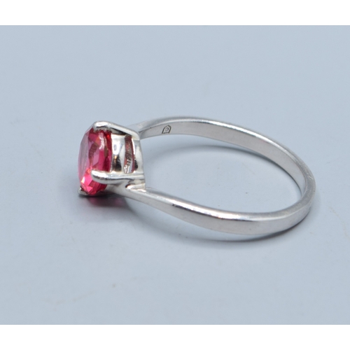 2526 - 925 silver enhanced Ruby solitaire dress ring in a twist design size T