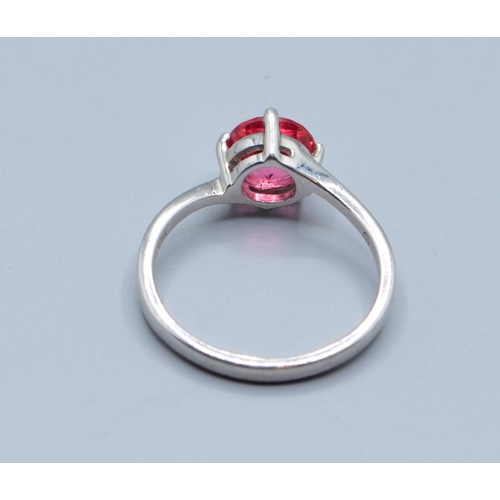 2526 - 925 silver enhanced Ruby solitaire dress ring in a twist design size T