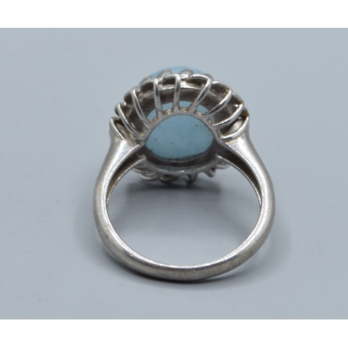 2528 - 925 silver ladies cabochon polished Amazonite dress ring held in a lural leaf setting size P