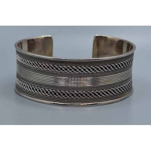 2529 - Good solid 925 silver ladies bangle with centre decoration and clear ends 6cm internal diameter, 2.5... 