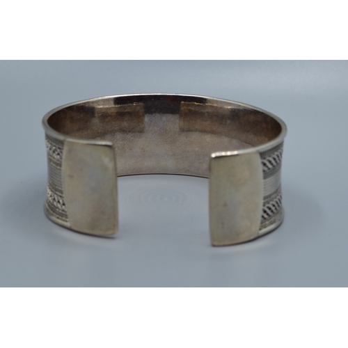 2529 - Good solid 925 silver ladies bangle with centre decoration and clear ends 6cm internal diameter, 2.5... 