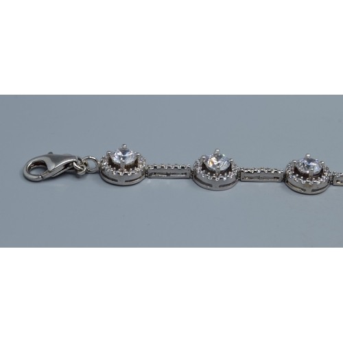 2537 - 925 silver ladies fancy link bracelet individual links being set with a clear gem stone halo and cle... 