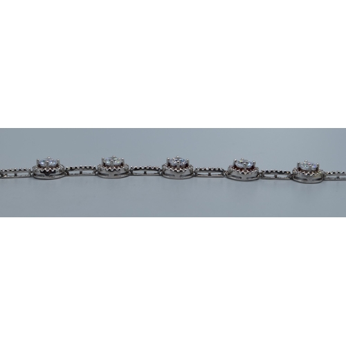 2537 - 925 silver ladies fancy link bracelet individual links being set with a clear gem stone halo and cle... 
