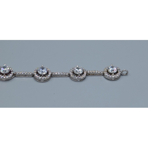 2537 - 925 silver ladies fancy link bracelet individual links being set with a clear gem stone halo and cle... 