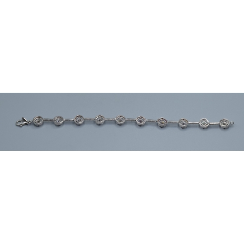 2537 - 925 silver ladies fancy link bracelet individual links being set with a clear gem stone halo and cle... 