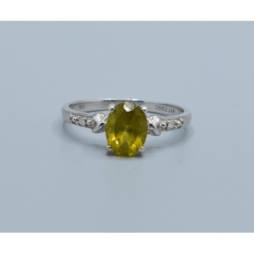 2545 - 9ct white gold ladies Peridot and Diamond dress ring the main stone being 8x6mm size N