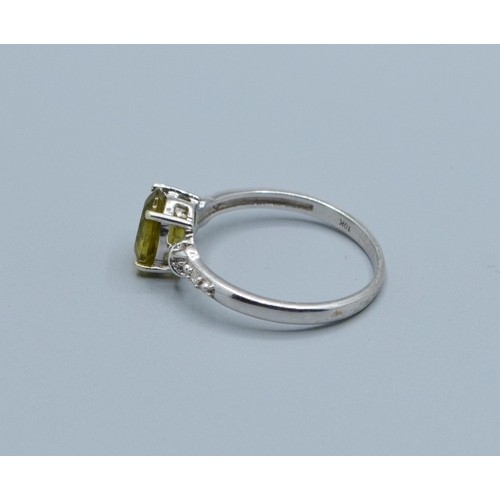 2545 - 9ct white gold ladies Peridot and Diamond dress ring the main stone being 8x6mm size N