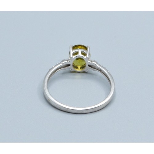 2545 - 9ct white gold ladies Peridot and Diamond dress ring the main stone being 8x6mm size N