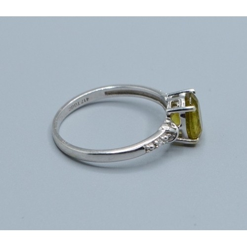 2545 - 9ct white gold ladies Peridot and Diamond dress ring the main stone being 8x6mm size N