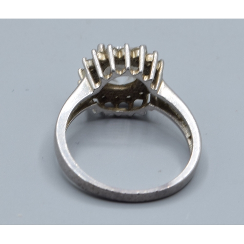 2550 - 925 silver ladies clear gem set square faced halo dress ring set in a castled claw design size R