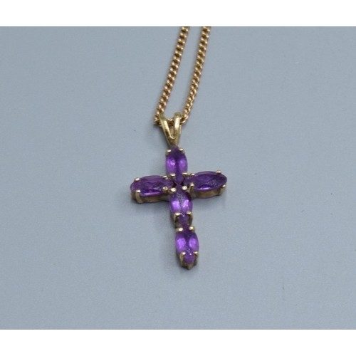 2553 - 9ct gold Amethyst cross measuring 2.3x1.3cm including the bale on a 9ct gold neck chain of 52cm long... 
