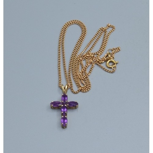 2553 - 9ct gold Amethyst cross measuring 2.3x1.3cm including the bale on a 9ct gold neck chain of 52cm long... 