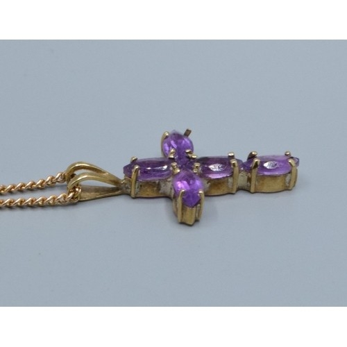 2553 - 9ct gold Amethyst cross measuring 2.3x1.3cm including the bale on a 9ct gold neck chain of 52cm long... 