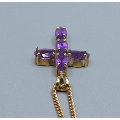 2553 - 9ct gold Amethyst cross measuring 2.3x1.3cm including the bale on a 9ct gold neck chain of 52cm long... 