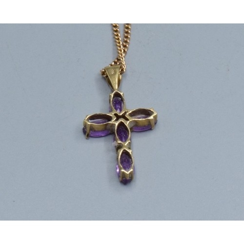 2553 - 9ct gold Amethyst cross measuring 2.3x1.3cm including the bale on a 9ct gold neck chain of 52cm long... 