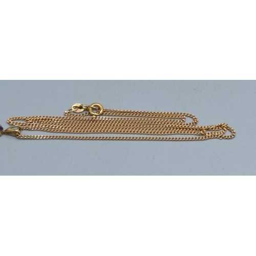 2553 - 9ct gold Amethyst cross measuring 2.3x1.3cm including the bale on a 9ct gold neck chain of 52cm long... 