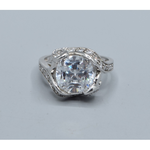 2568 - Ladies square faced 925 silver statement ring with clear gem set main stone and decorated by smaller... 