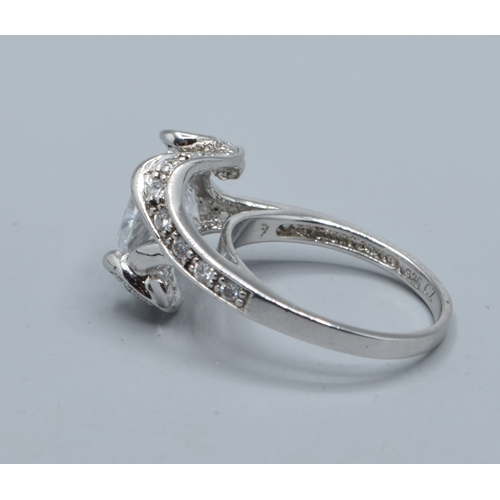 2568 - Ladies square faced 925 silver statement ring with clear gem set main stone and decorated by smaller... 