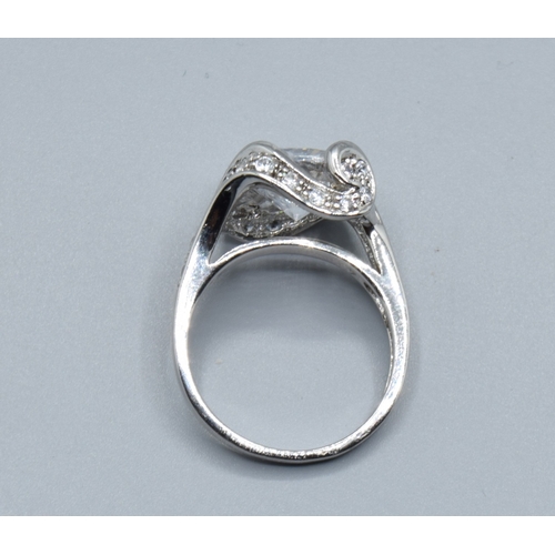 2568 - Ladies square faced 925 silver statement ring with clear gem set main stone and decorated by smaller... 