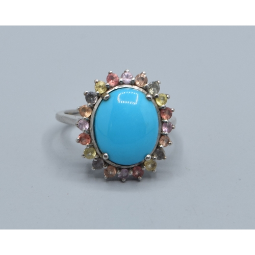 2580 - 925 silver ladies oval cabochon Turquoise halo design ring the halo being made up of multi coloured ... 
