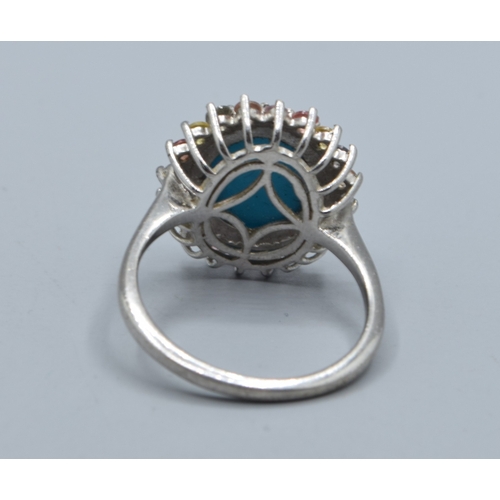 2580 - 925 silver ladies oval cabochon Turquoise halo design ring the halo being made up of multi coloured ... 