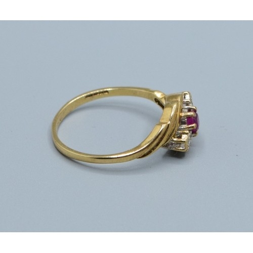 2582 - 9ct gold ladies vintage 3 stone Ruby and Diamond ring in a sweep design hallmarked as Diamond size P