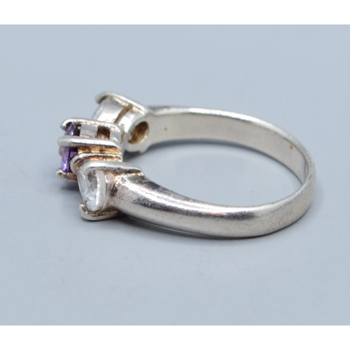 2586 - 925 silver ladies Amethyst centre flanked by twin tear drop design clear gem stones size M