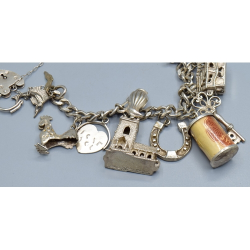 2589 - Ladies 925 silver charm bracelet with padlock catch and safety chain, together with 15 charms to inc... 