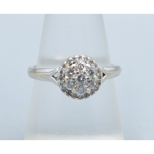 2602 - 9ct white gold (tested) ladies Diamond halo cluster ring the head size being 9.5mm diameter with an ... 