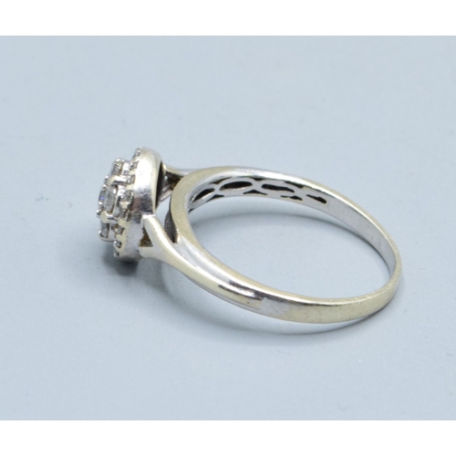 2602 - 9ct white gold (tested) ladies Diamond halo cluster ring the head size being 9.5mm diameter with an ... 