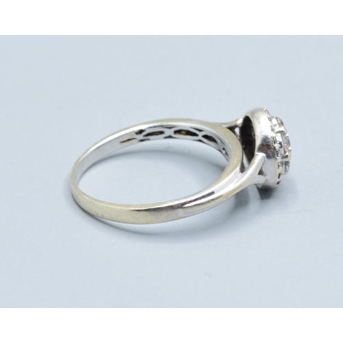 2602 - 9ct white gold (tested) ladies Diamond halo cluster ring the head size being 9.5mm diameter with an ... 