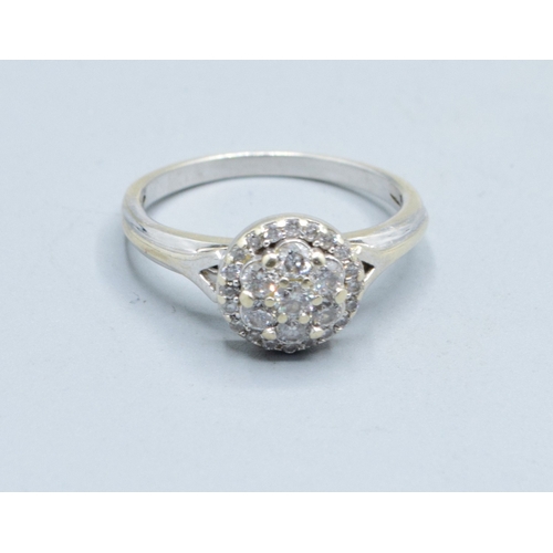 2602 - 9ct white gold (tested) ladies Diamond halo cluster ring the head size being 9.5mm diameter with an ... 