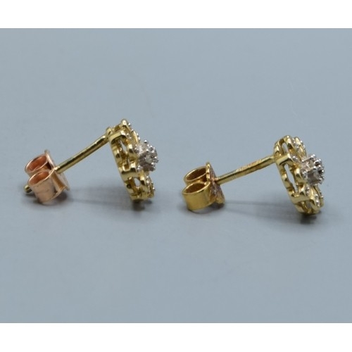 2615 - Pair of vintage 9ct gold and Diamond floral studs, 9mm diameter