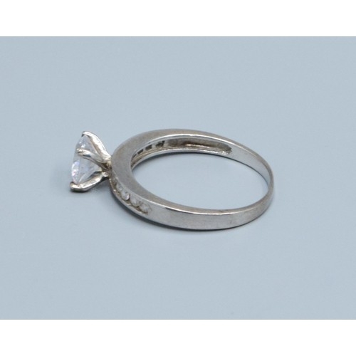 2620 - 925 silver ladies clear gem set solitaire with gem set decoration to the shoulders size P